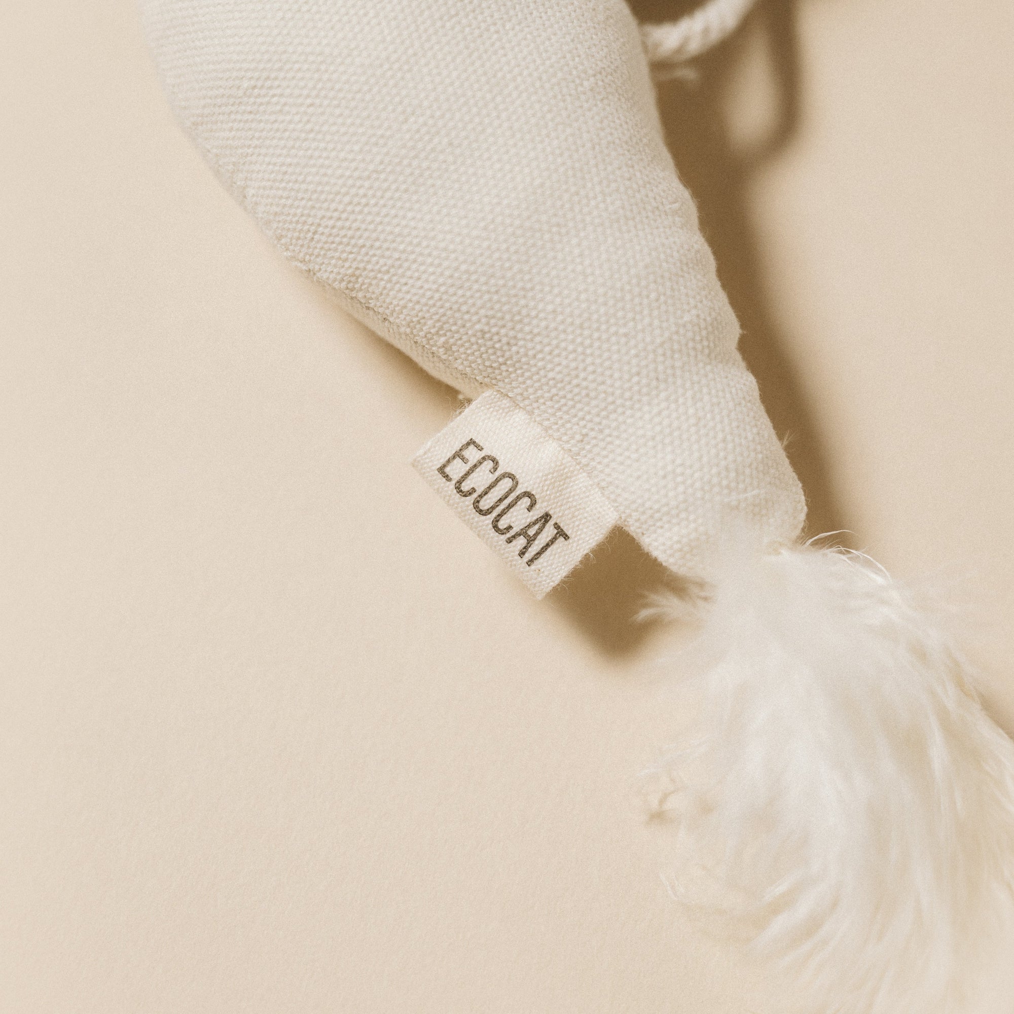 Ecoca cat toy with a visible brand tag on a beige background